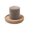 Candle on round wooden base